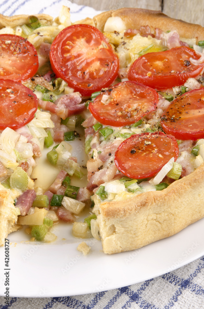 spring onion and bacon quiche with tomato
