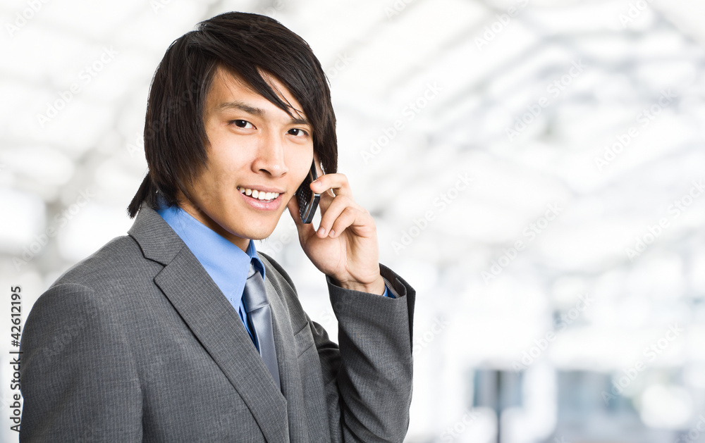Oriental businessman on the phone Oriental businessman on the phone