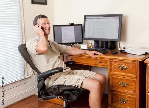 Senior male working in home office