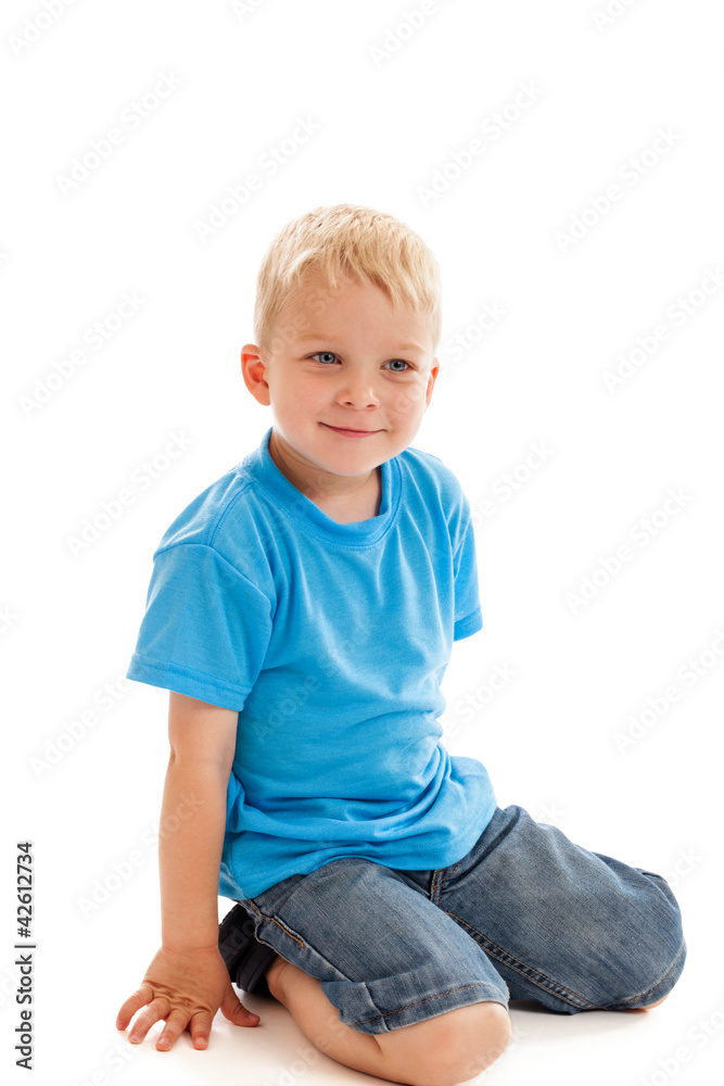 Happy little boy sitting on knees isolated on white Happy little boy sitting on knees isolated on white