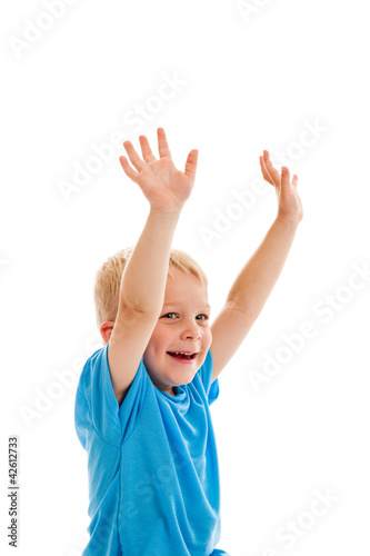 Little boy raising hands isolated on white