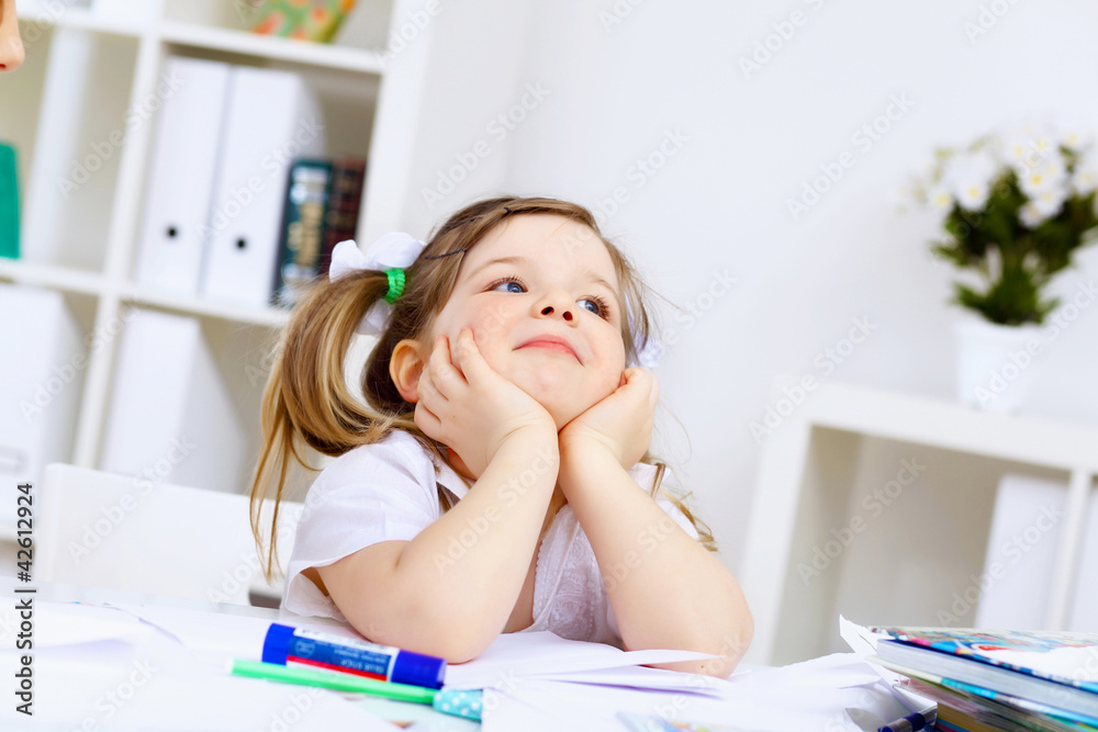 Little girl and her mother studying Little girl and her mother studying