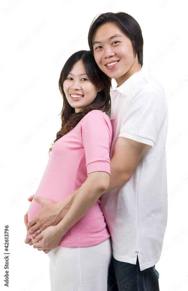 Asian man holding his pregnant wife's belly Asian man holding his pregnant wife's belly