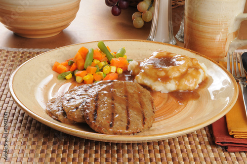 Delicious salisbury steak dinner photo