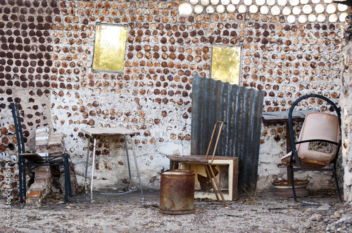 Interior of an old home built from tin cans with old furniture in Lightning Ridge in outback Australia photo