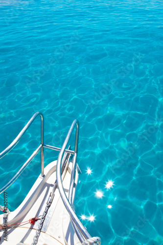 Balearic blue clean turquoise water from boat bow