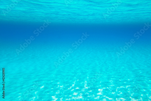 Blue turquoise underwater view of tropical beach