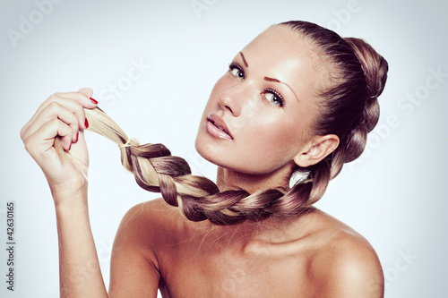 young woman with long natural mixed color braid