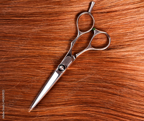 straight healthy woman hair and scissors