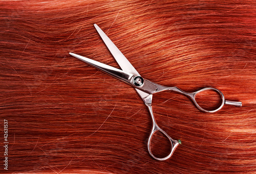 straight healthy woman hair and scissors