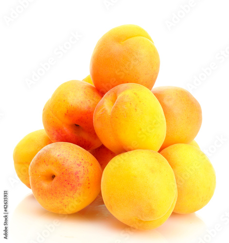 ripe apricots isolated on white