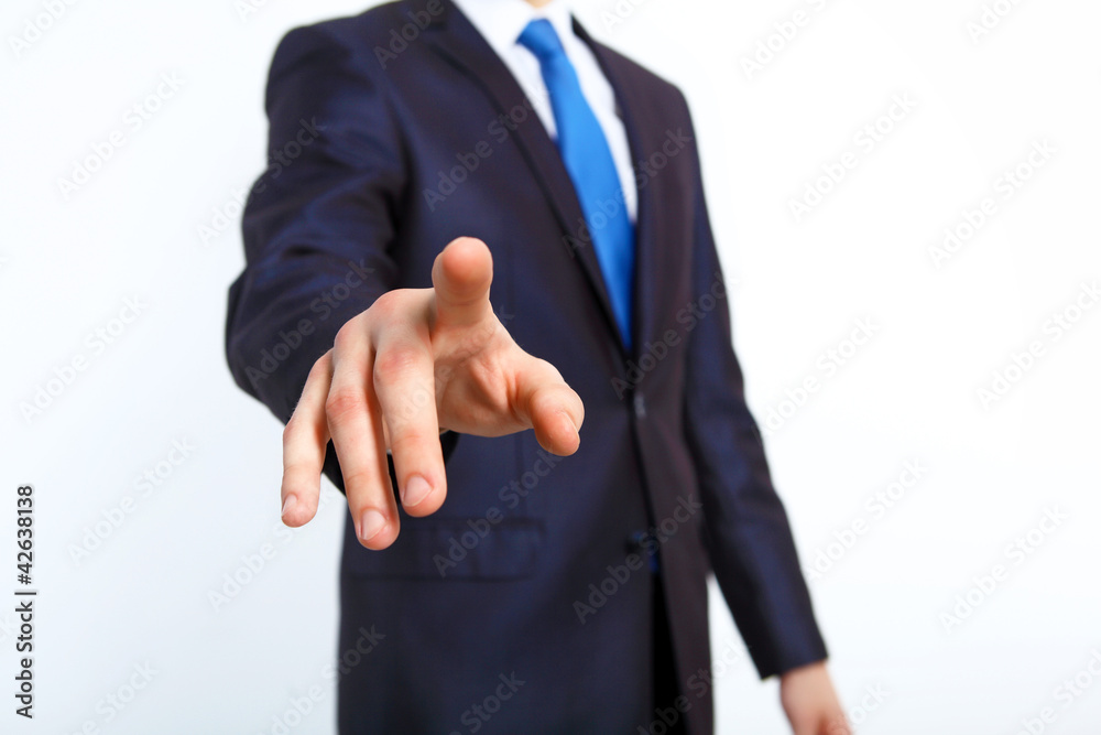 Businessman pushing a button with his finger