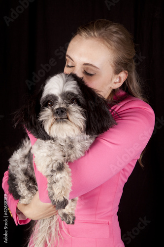 woman pink jacket dog looking