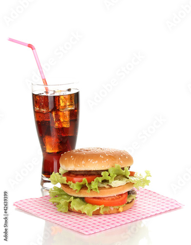 Big and tasty hamburger and cola isolated on white