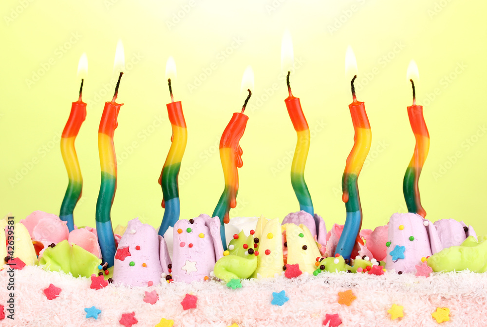 Birthday cake with candles on green background Birthday cake with candles on green background