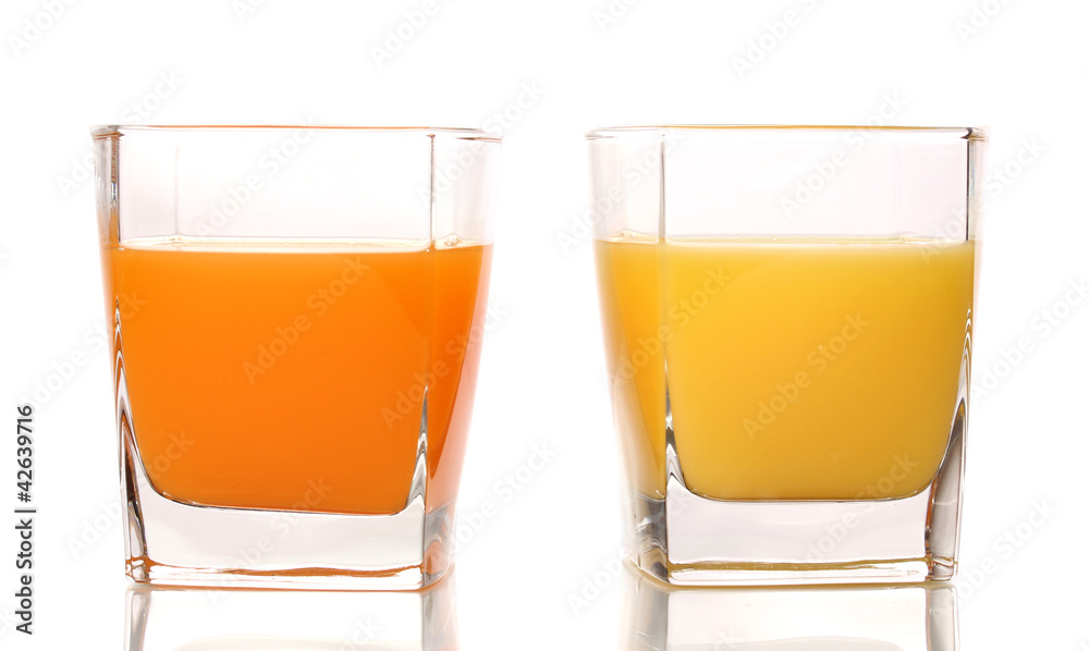 Tropical juices in glasses isolated on white Tropical juices in glasses isolated on white