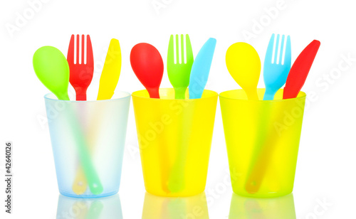 bright plastic disposable tableware isolated on white background