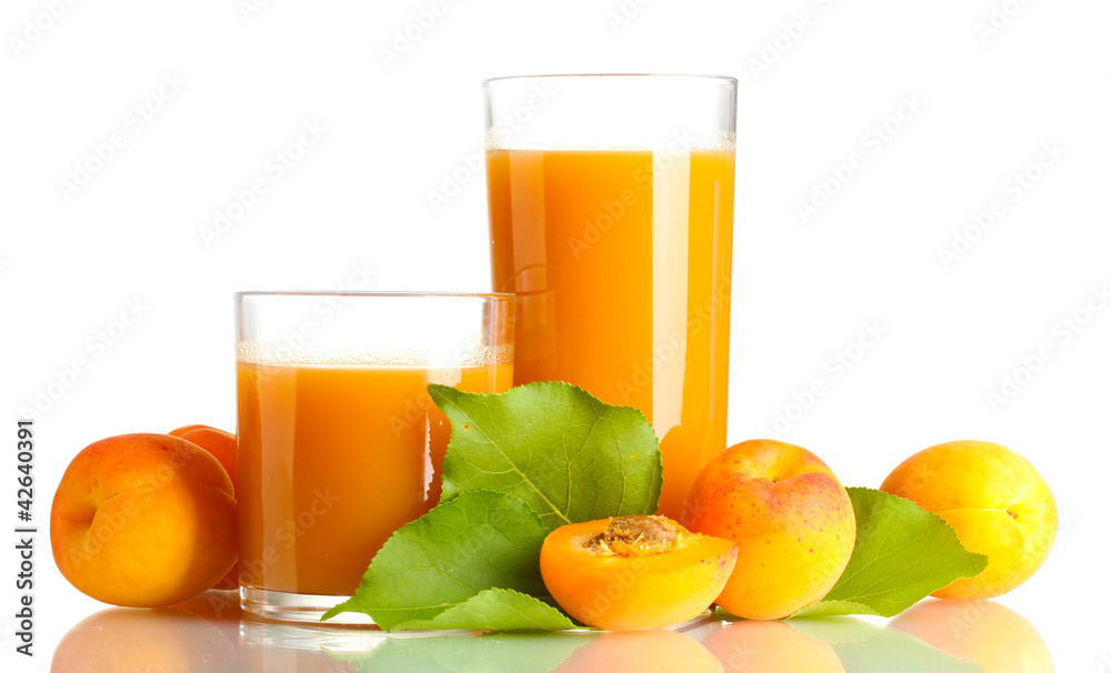 two glasses of apricot juice and apricots with leaves isolated