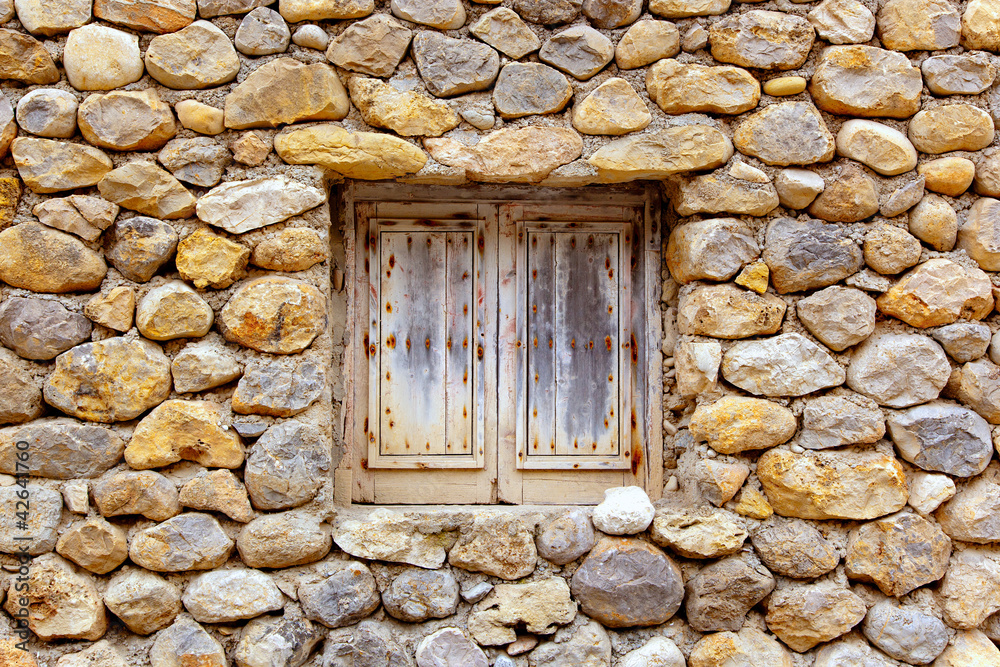 masonry stone wall with grunge wood window masonry stone wall with grunge wood window
