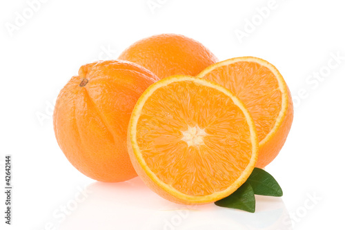 orange fruit and slices isolated on white