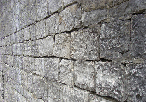 very old stone rock wall detail