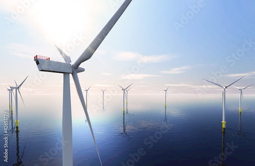 Offshore wind turbines in sunset on the ocean