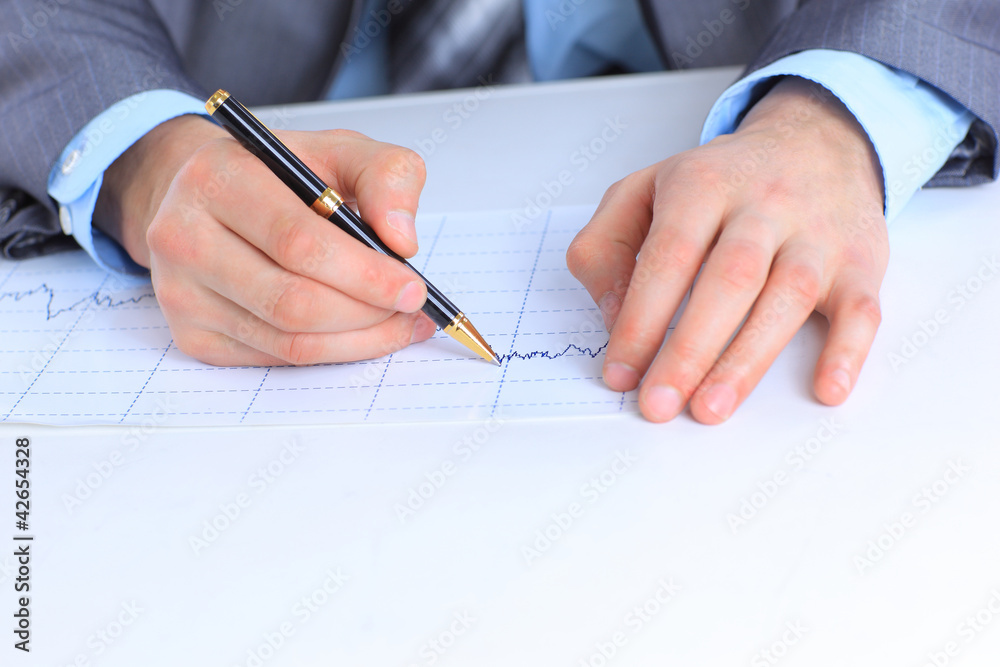 man's hand holding a pen writing a signature, man's hand holding a pen writing a signature,