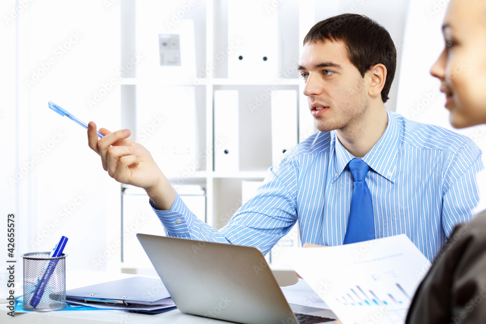 Young businessman in the office Young businessman in the office