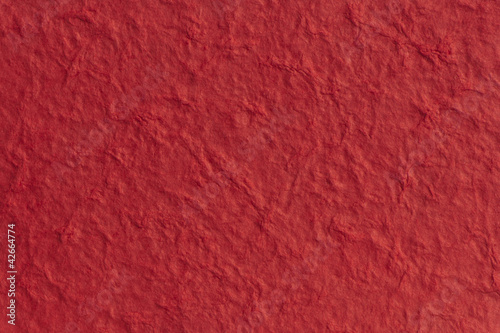 textured paper with a fibrous look, red
