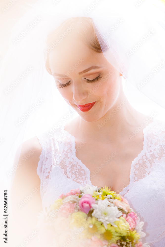 Beautiful bride posing in her wedding day Beautiful bride posing in her wedding day