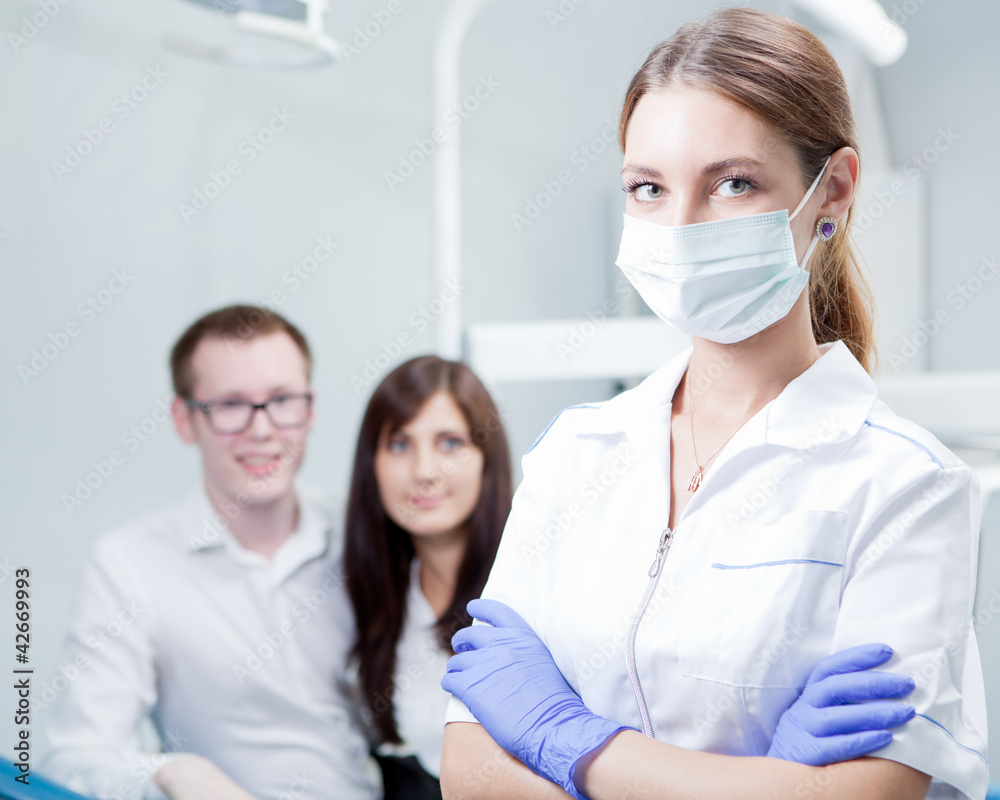 Dentist and young couple Dentist and young couple