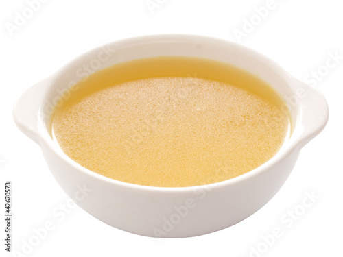 close up of a bowl of chicken broth
