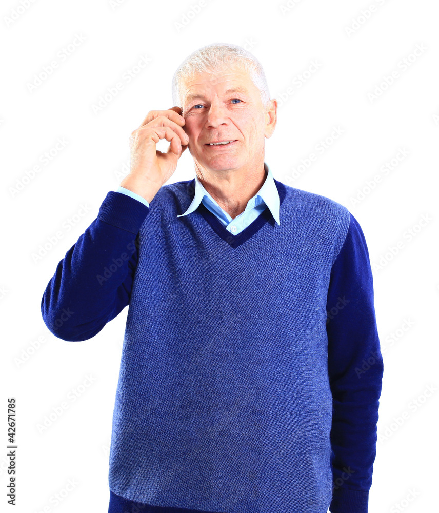 Businessman standing, looking off into distance