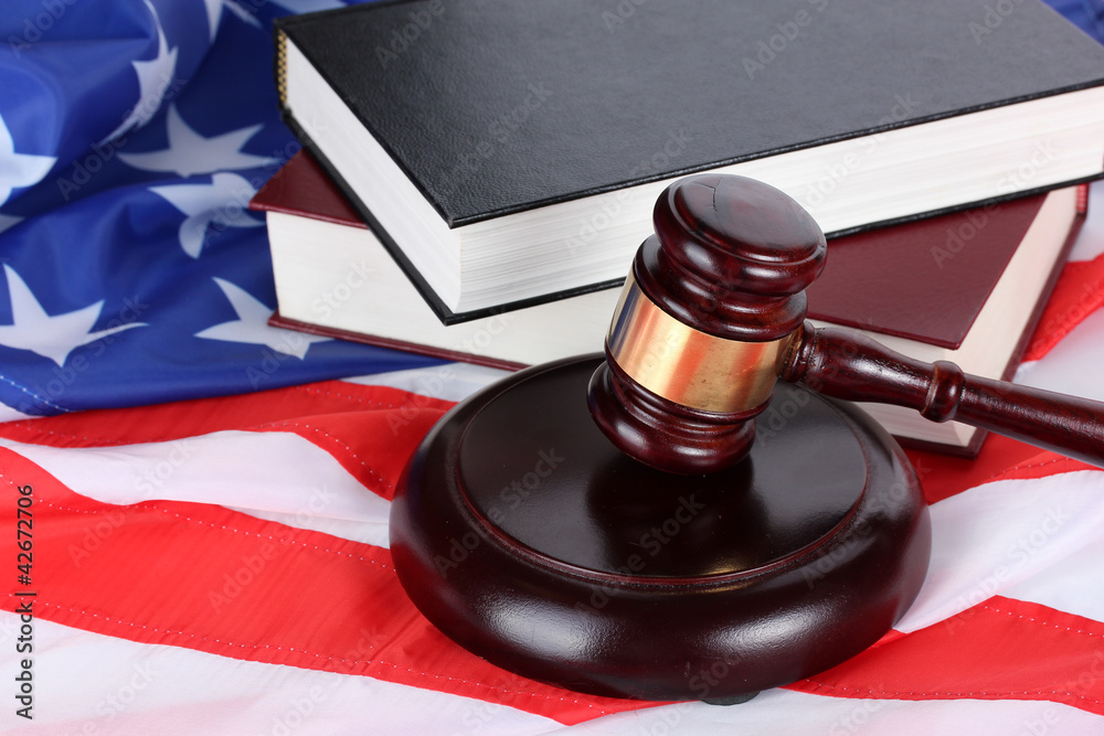judge gavel and books on american flag background