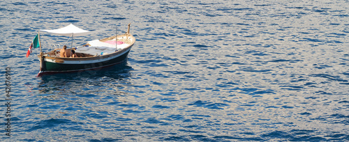old style boat in ligurian sea- gozzo ligure photo