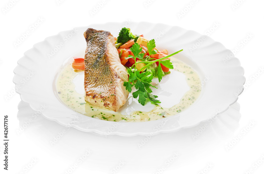 fish and begetables isolated on a white background fish and begetables isolated on a white background