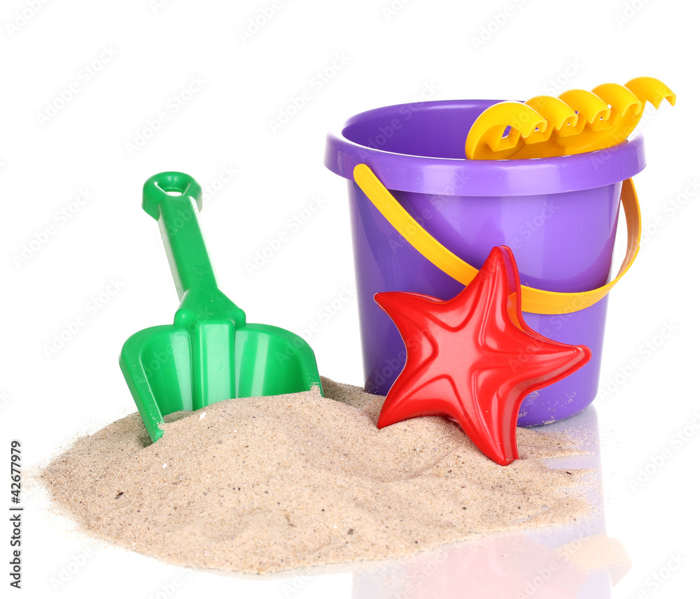 Children's beach toys and sand isolated on white Children's beach toys and sand isolated on white