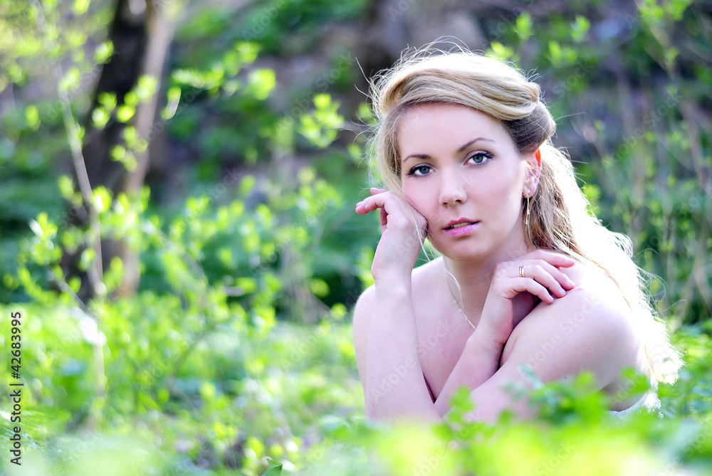 beautiful girl in wood amongst green sheet beautiful girl in wood amongst green sheet