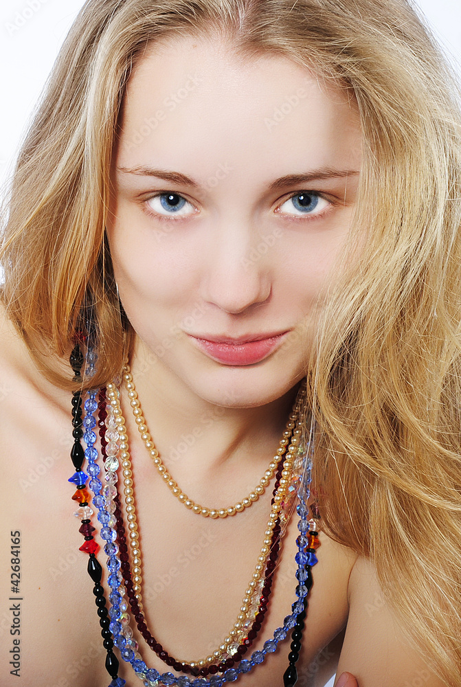 Portrait of the beautiful girl in costume jewellery