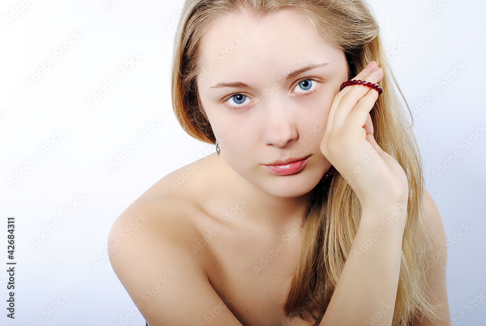Portrait of the beautiful girl in costume jewellery Portrait of the beautiful girl in costume jewellery