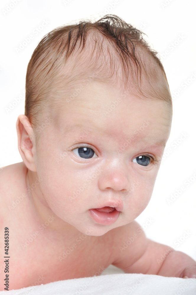 Portrait of cute newborn baby girl on a white background Portrait of cute newborn baby girl on a white background