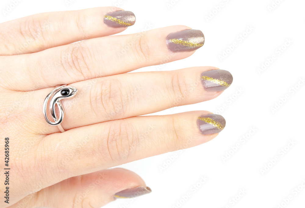 Woman's hand with  manicureand silver snake ring.