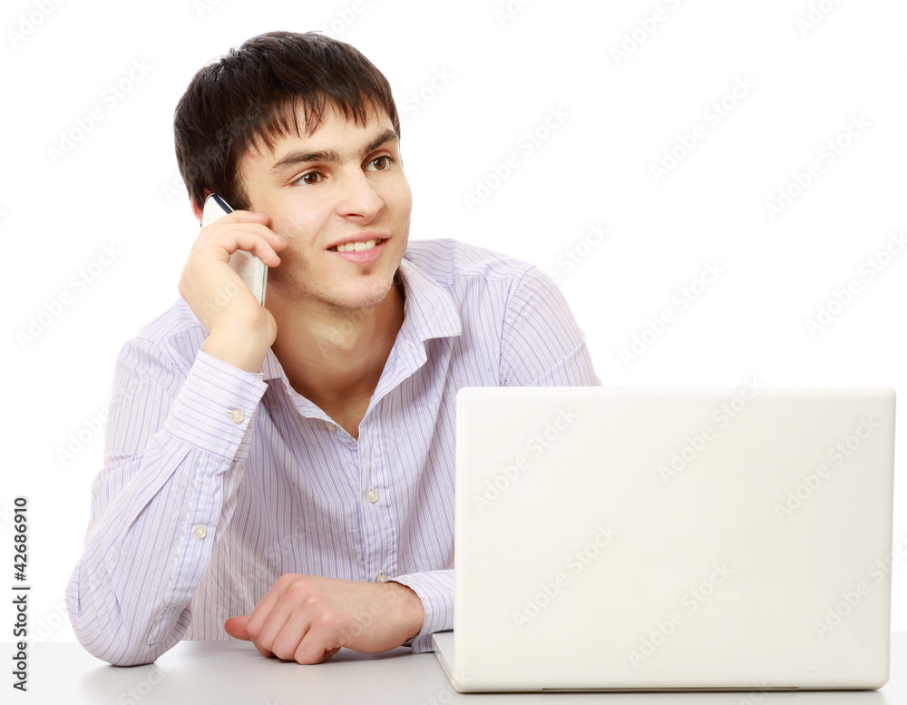 A young businessman talking on the phone A young businessman talking on the phone