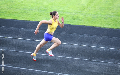 Girl running on the track