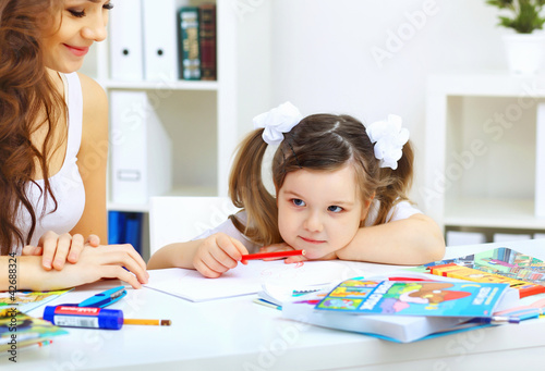 Mother and daughter studying