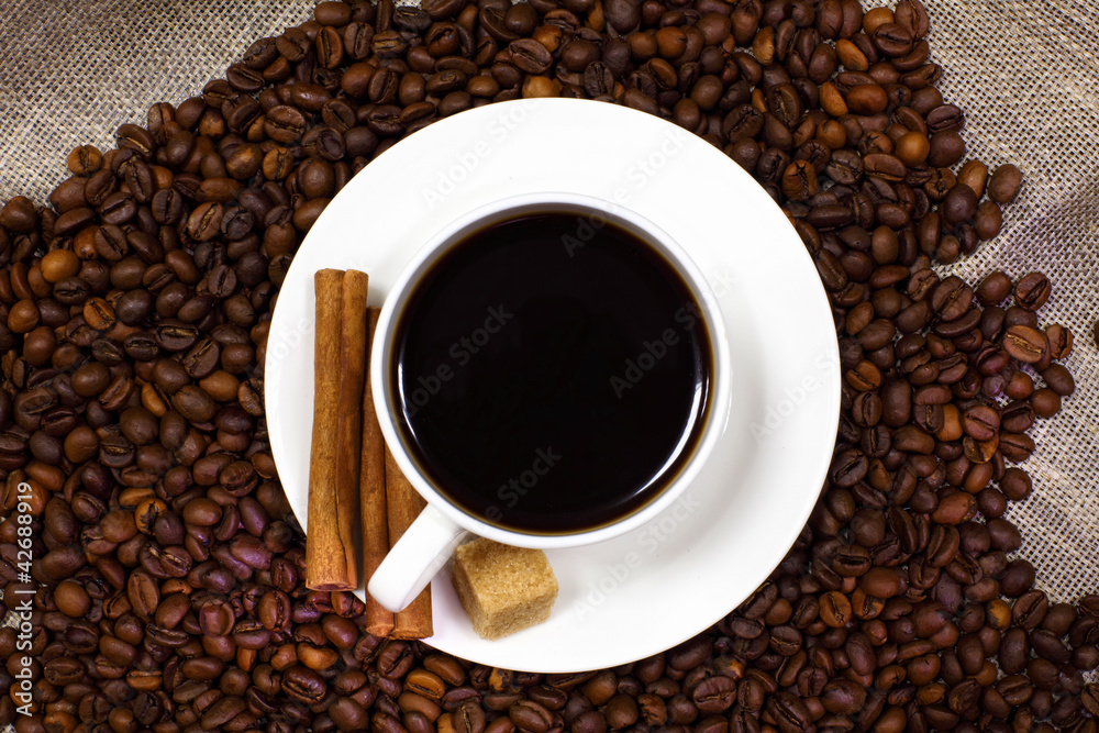 Coffee beans and white cup Coffee beans and white cup