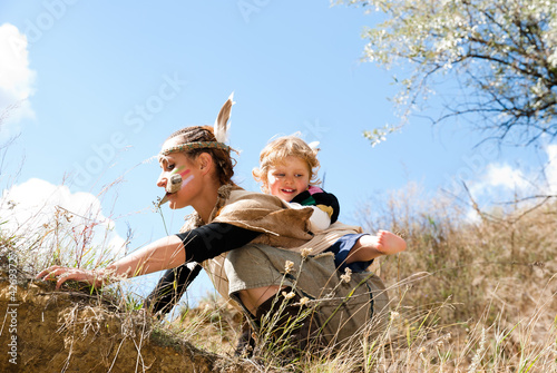 Red Indian girl in the image with your kid to hunt for prey photo