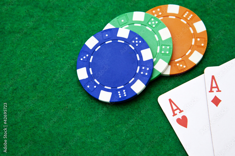 Texas holdem pocket aces on casino table with copy space and chi Texas holdem pocket aces on casino table with copy space and chi