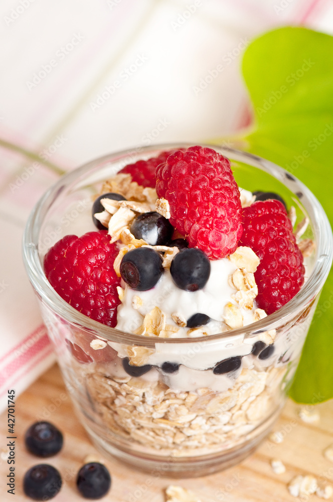 Muesli with yogurt raspberries and blueberries for breakfast Muesli with yogurt raspberries and blueberries for breakfast