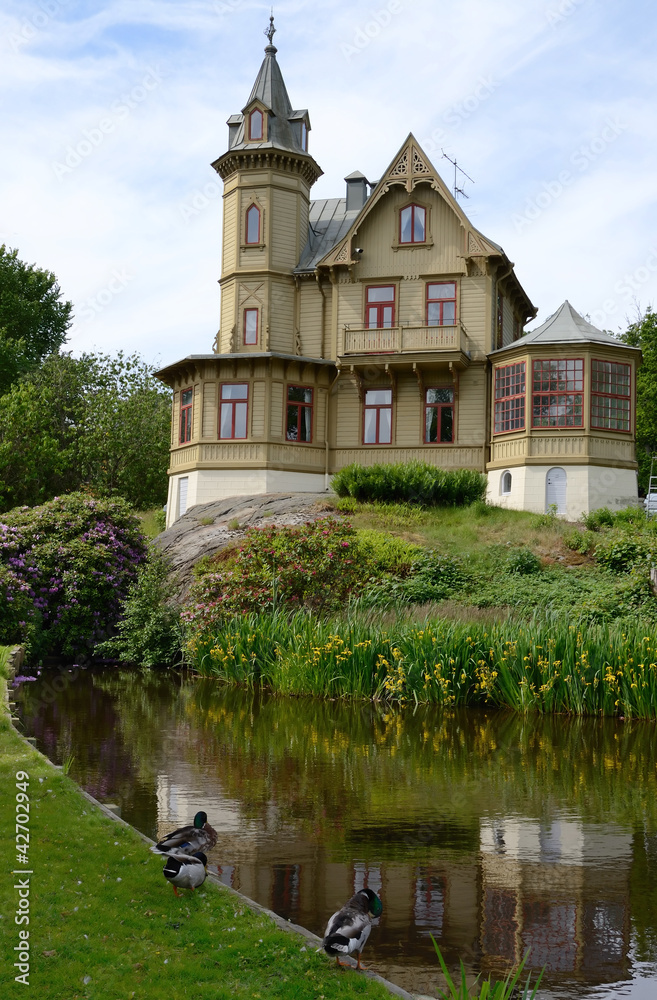 Ronneby park's small castle with water reflection